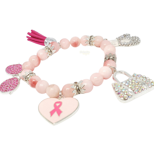 A single pink beaded stretch bracelet with 4 CZ crystal charms. Breast cancer awareness themed