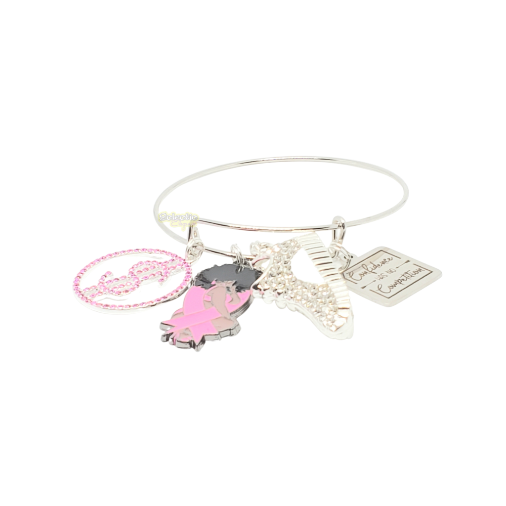 1 adjustable silver plated and pink breast cancer awareness bangle. Bangle has 4 charms 2 of wich have CZ crystals